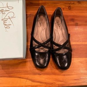 Women’s black leather stride ride flats